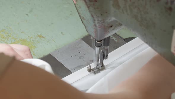 Women's Hands Behind Her Sewing Machine alt