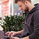 Student Working on a Tablet in Shopping Center. Student Working on a Tablet in Shopping Center. - VideoHive Item for Sale
