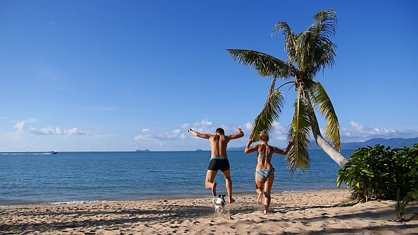 Happy Family Running to the Sea and Swim alt