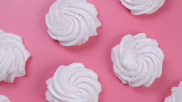 Rotating Background of Marshmallows or Cakes Birthday Cakes on a Pink Background alt