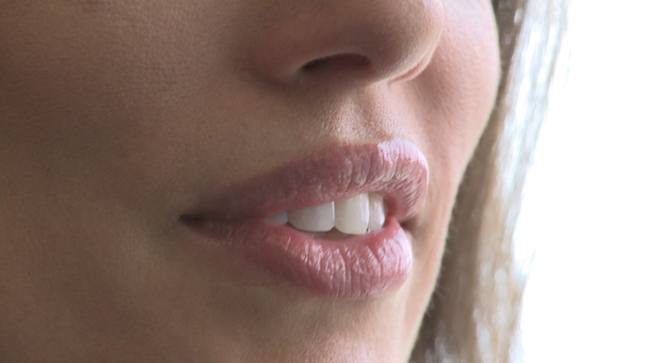 Closeup Of Woman's Mouth As She Converses (2 Of 3)