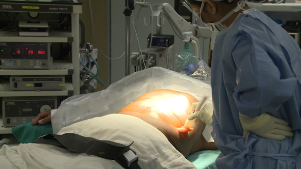 Nurse Preps Patient For Laparoscopic Surgery