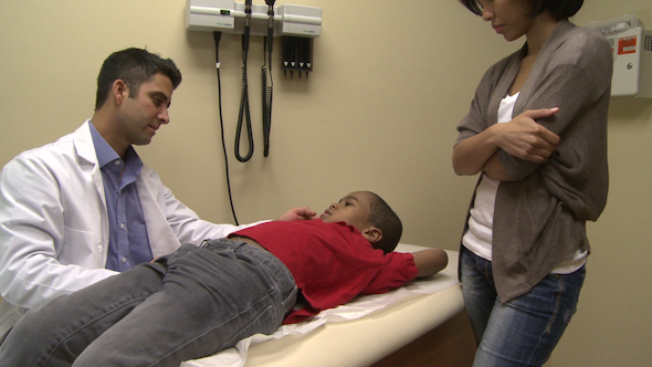 Male Doctor Examines Sick Child (3 Of 4)