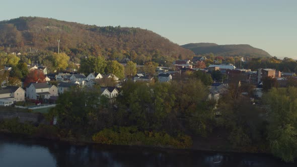 Flying over Hudson River in cloud covered Autumn sky alt