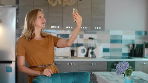 Midlife Woman Looking in Frontal Camera Making Selfie Photo Rbbro alt