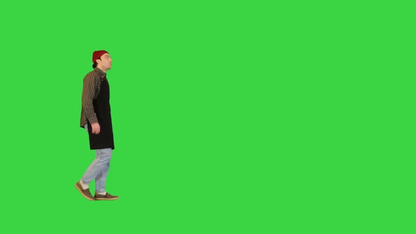 Handyman Walks After Workday Wiping His Hands on a Green Screen Chroma Key alt