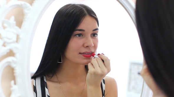 Female Doing Lips Makeup