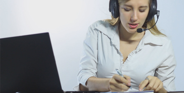Call Center Worker Making Notes and Talking, Stock Footage | VideoHive