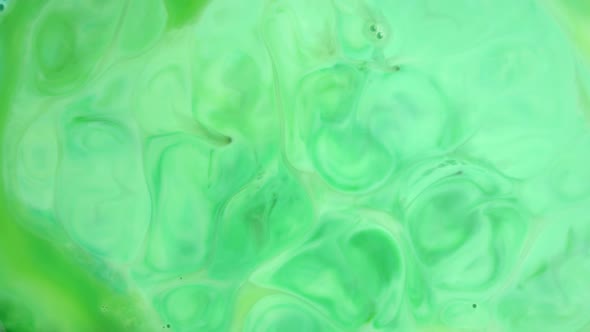  Footage. Ink in Water. Green Ink Reacting in Water Creating Abstract Background.