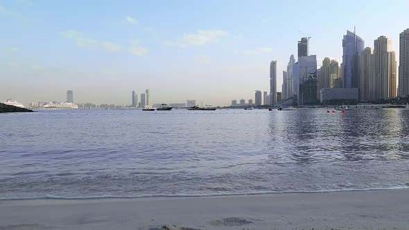 Panoramic View of Business Bay District with Reflection in Sea in Morning