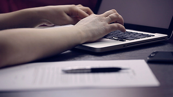 Woman Working on the Laptop and Write Contract alt