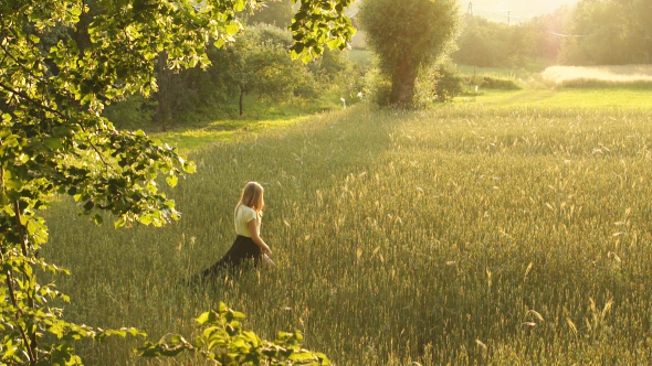 Girl Walking in a Field