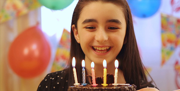 Girl Enjoying Birthday Cake alt
