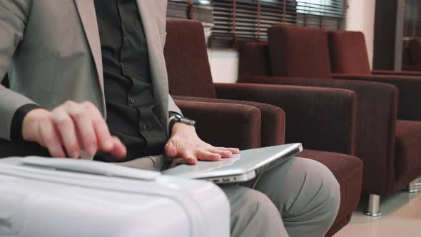 Businessman meeting on laptop, rushing to Boarding at boarding lounge of airline, business trip alt