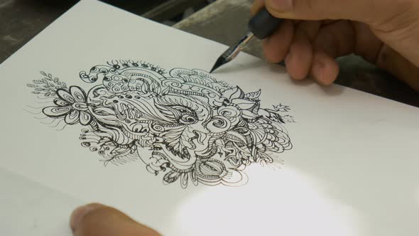 Closeup Artist Drawing Doodle Line Art with Black Ink