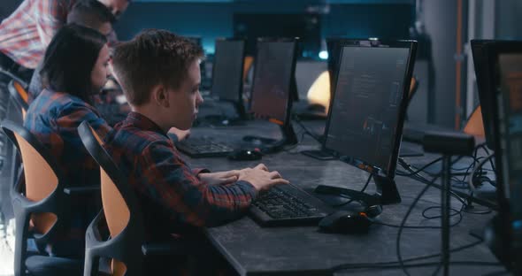 Student and Teacher Discussing Programming in School alt