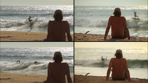 Guy Watching The Surfers In The Sea