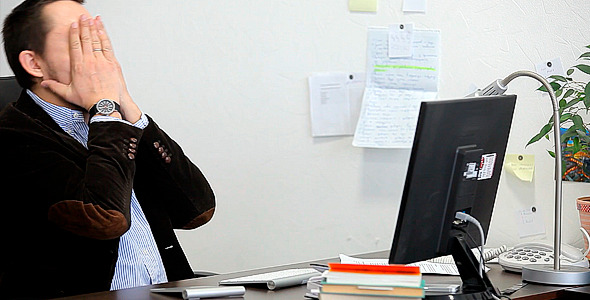 Businessman Tired at Work in the Office