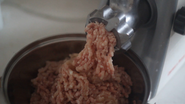 Minced Meat is Ground in a Meat Grinder alt