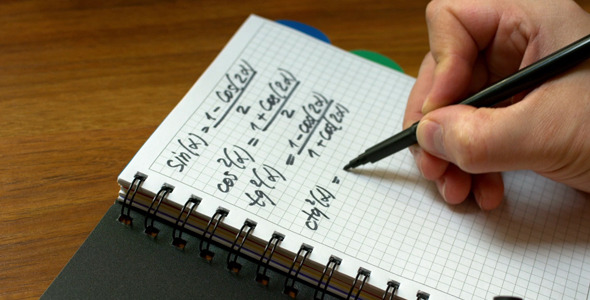 A Man Writes in a Notebook, a Mathematical Formula alt