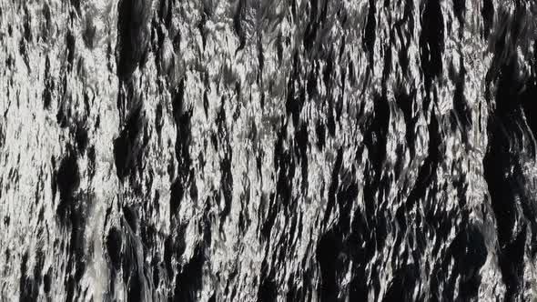 the Reflection of Sun on the Water at Sunset Small Waves Blue Water in Motion alt