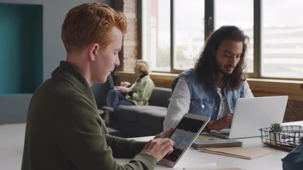 Creative Team of Businesspeople Working on Gadgets alt