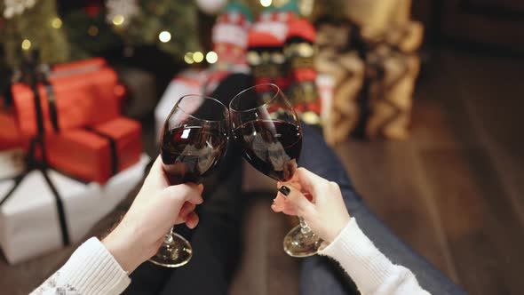 Happy Couple Clink Wine for Christmas and New Year Celebrations alt