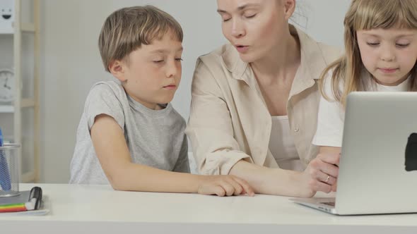 Mother and Two Children are Discussing Something alt