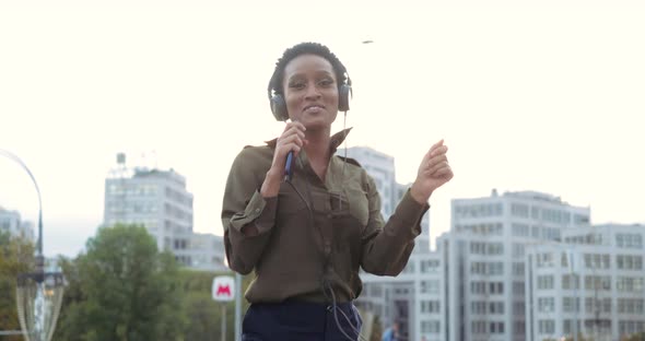 Active Cheerful Young Girl Teenager Resting Walking in Street in Fresh Air Listening Music Online in alt