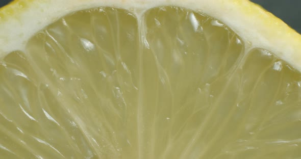 Sliced lemon rotating close up