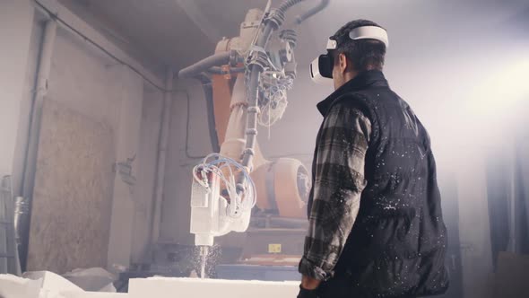 Craftsman in VR Headset Standing Near Milling Machine alt