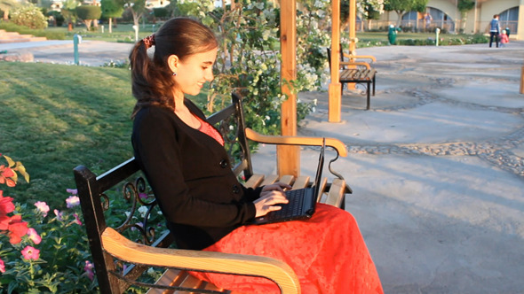 Young Woman Chatting On Laptop