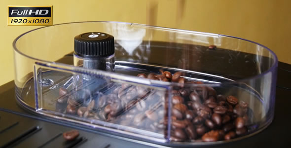 Adding of Roasted Coffee Beans to the Coffee Machi