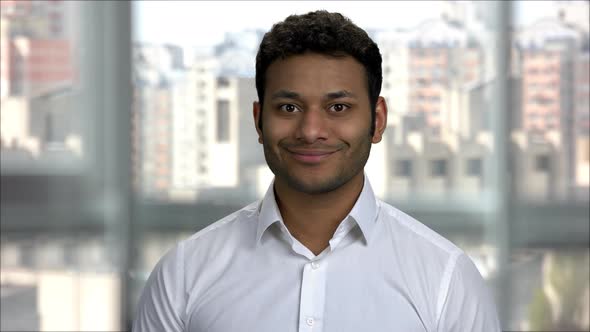 Portrait of Young Handsome Indian Man with Smiling Expression alt