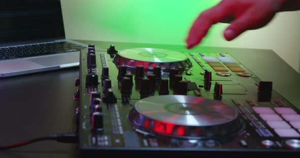 DJ Using His Mixer Table 13B