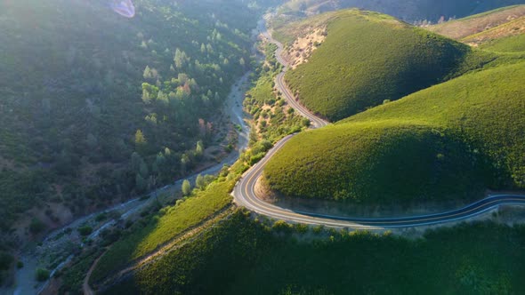 Flight Over the Road in the Mountains of California and Yosemite National Park alt