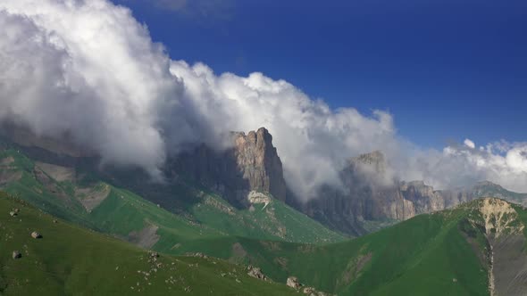 Caucasus Mountains Under Moving Clouds alt