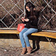 Young Woman Using Tablet on Park Bench - VideoHive Item for Sale
