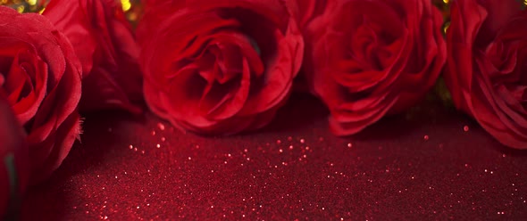 Sparkling red glitter and red roses