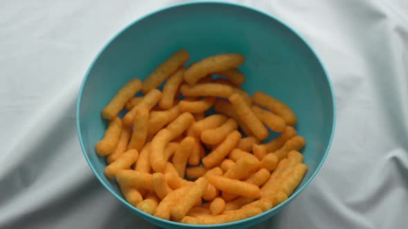 Eating A Bowl Of Cheese Puffs (2 Of 3)