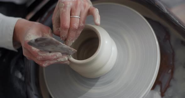 Top View Ceramist Sculpts a Jug on a Potter's Wheel Video From Pottery Workshop Potter Makes