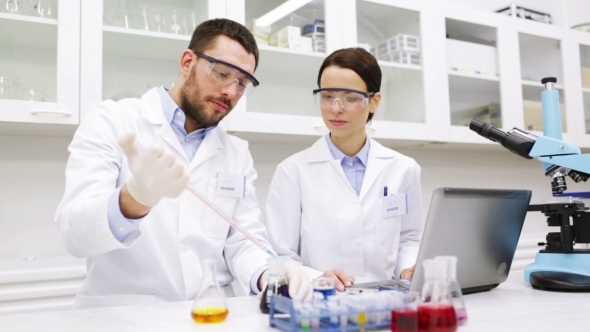 Young Scientists Making Test Or Research In Lab alt