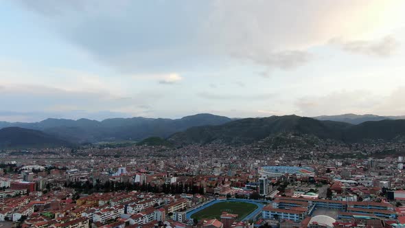 Panoramic View Over Cusco City And Stadiums In Peru - aerial drone shot alt