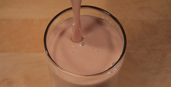 Pouring Chocolate Milk Into Glass