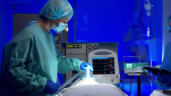 Female Medics Performing Surgery in Operating Theater