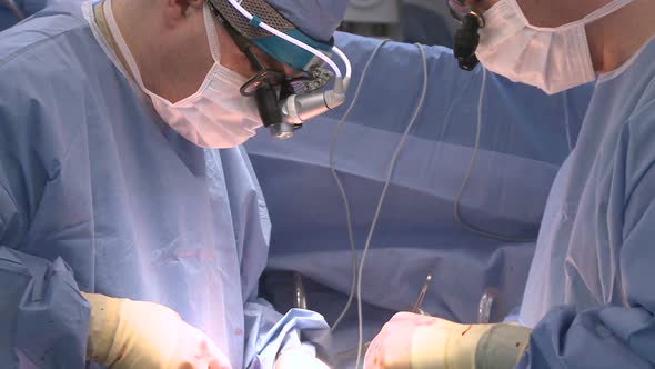 Doctors Concentrate On Surgery