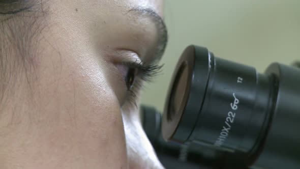 Closeup Of Eyes Looking Through Microscope (1 Of 3)