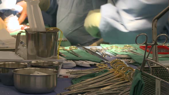 Nurse Organizes Surgical Instruments