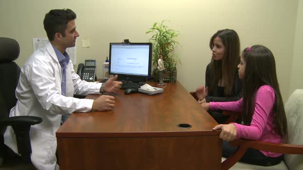 Male Doctor Consults With Mother And Daughter (7 Of 7)
