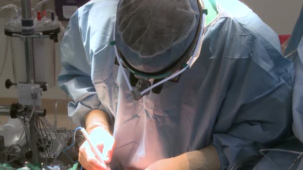 Pan Down Of Doctor Using Electrocautery During Surgery